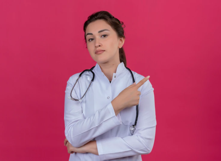 Free-Photo-Thinking-doctor-young-girl-wearing-medical-gown-and-stethoscope-points-to-side-on-isoleted-red-background